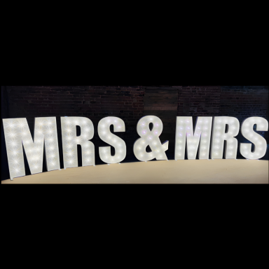 Decorative illuminated letters spelling "MRS & MRS".